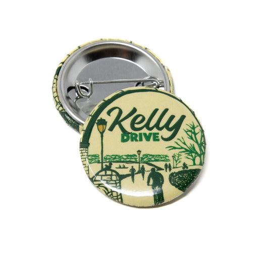 Button pin with 'Kelly Drive' text and design on a white background