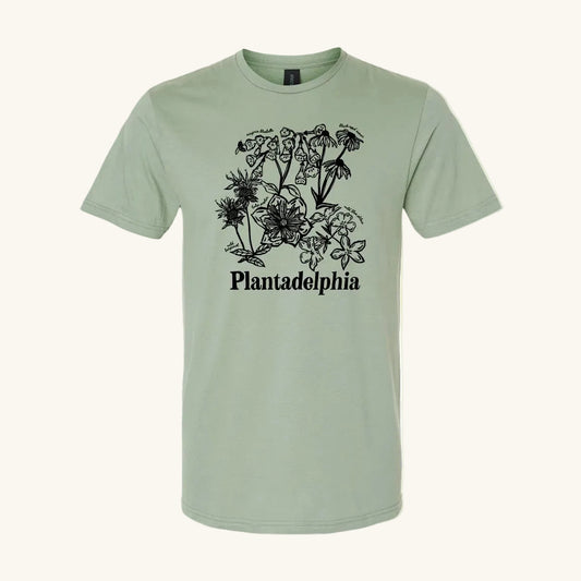 light green t-shirt with black floral design and 'Plantadelphia' text on a yellow background