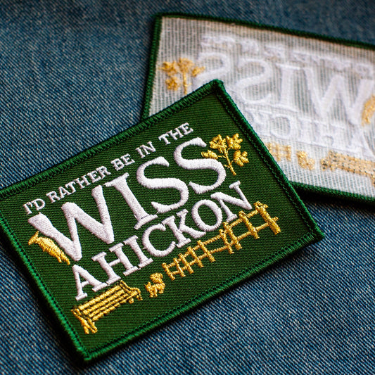 Embroidered patch with text 'I'd rather be in the Wissahickon' on a denim background