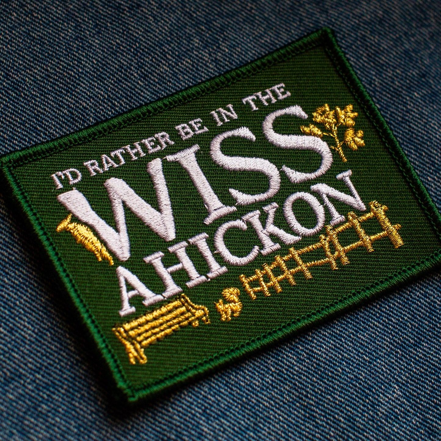 Embroidered patch with text 'I'd rather be in the Wissahickon' on a denim background
