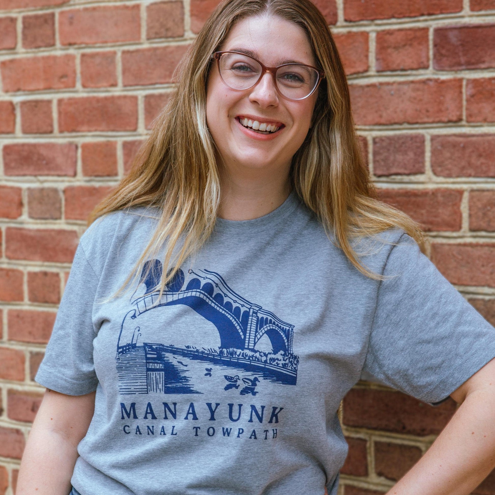 Illustration of the Manayunk towpath in Philadelphia screen printed in blue on a Grey T shirt
