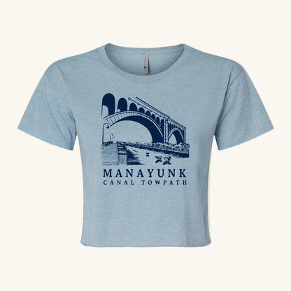light blue crop top with a bridge and nature graphic and 'Manayunk Canal Tow Path' text.