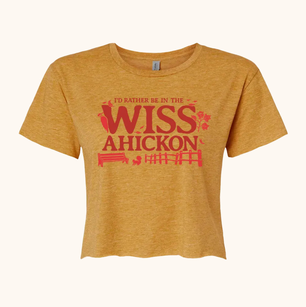 Yellow crop with 'I'd rather be in the Wissahickon' text and nature graphics on a beige background