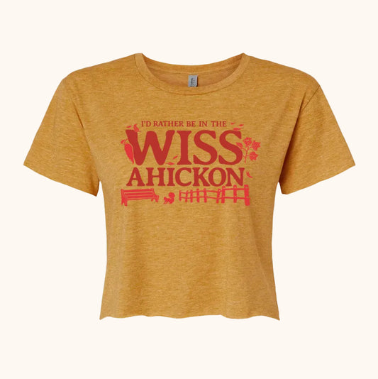 Yellow crop with 'I'd rather be in the Wissahickon' text and nature graphics on a beige background