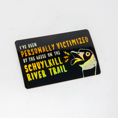 sticker with text saying "I've been personally victimized by the geese on the Schuylkill River Trail" with a goose hissing
