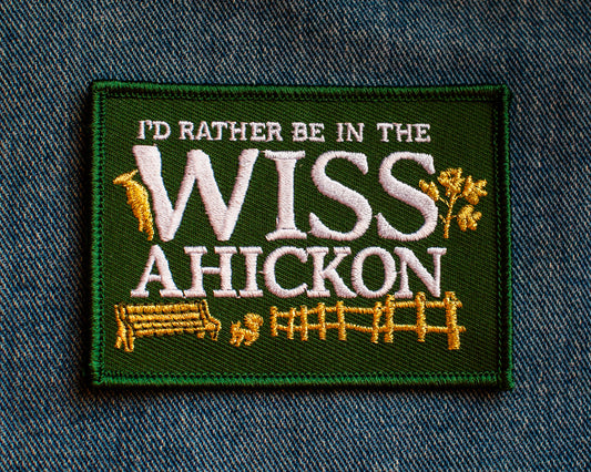 Embroidered patch with 'I'd Rather Be in the Wiss Ahickon' text on a denim background