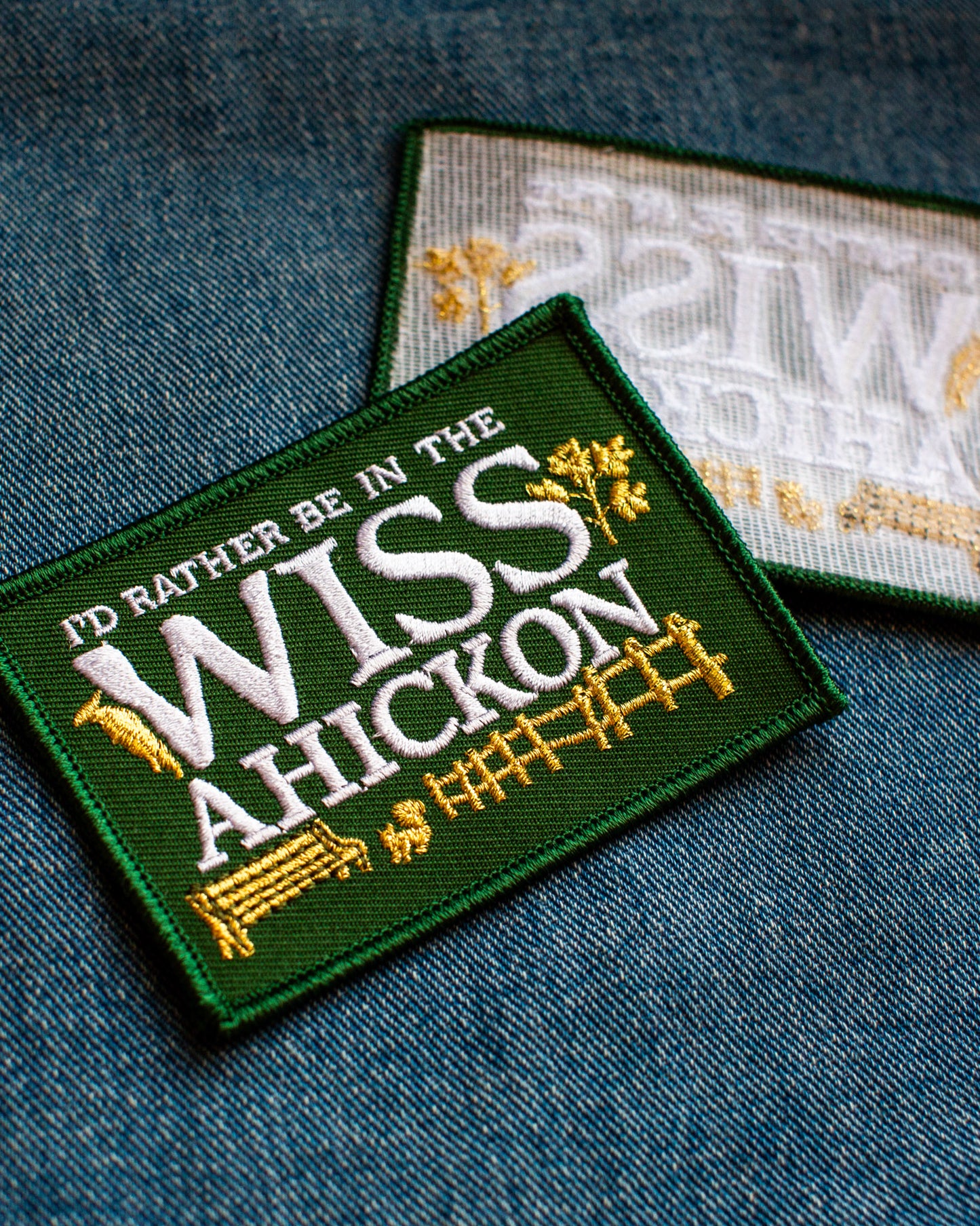 Embroidered patch with text 'I'd rather be in the Wissahickon' on a denim background
