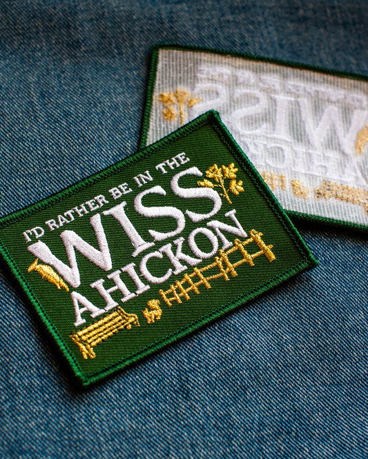 Embroidered patch with text 'I'd rather be in the Wissahickon' on a denim background