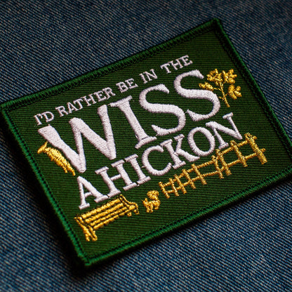 Embroidered patch with text 'I'd rather be in the Wissahickon' on a denim background