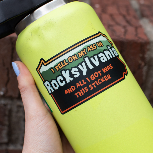 Pennsylvania shaped sticker with text "I fell on my ass in Rocksylvania and all I got was this sticker" on a water bottle