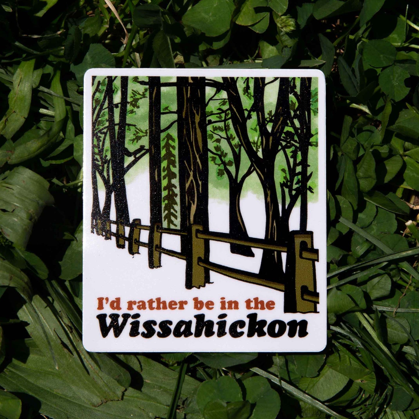 sticker with a forest design and text 'I'd rather be in the Wissahickon' on a grass background.