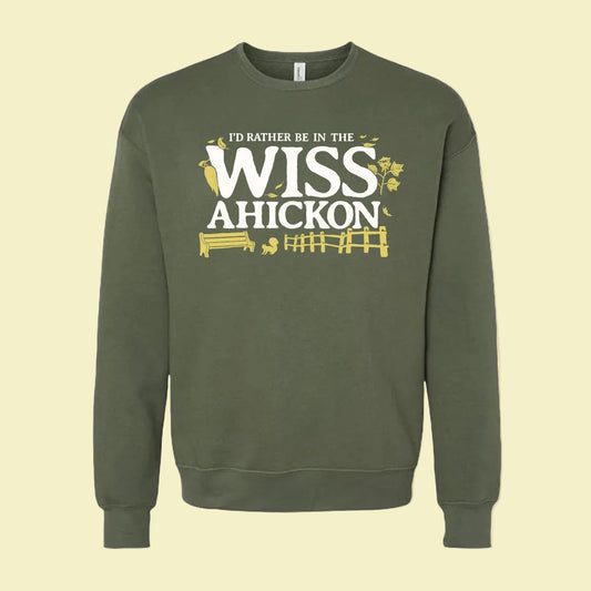Green sweatshirt with 'I'd Rather Be in the Wissahickon' text on a beige background