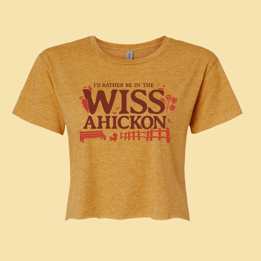 Yellow crop with 'I'd rather be in the Wissahickon' text and nature graphics on a beige background