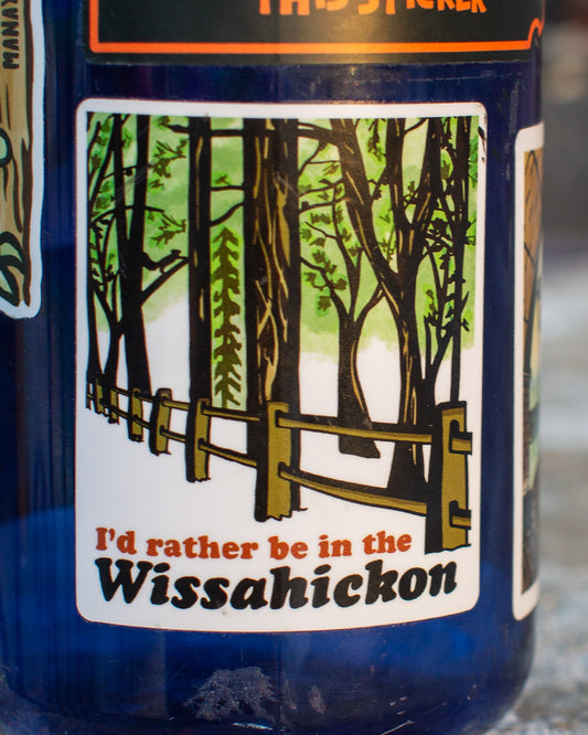 sticker with a forest design and text 'I'd rather be in the Wissahickon' on a blue water bottle.